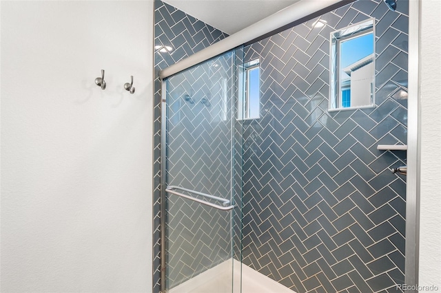 full bath featuring a tile shower