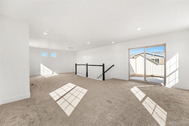 empty room with a healthy amount of sunlight, baseboards, and recessed lighting