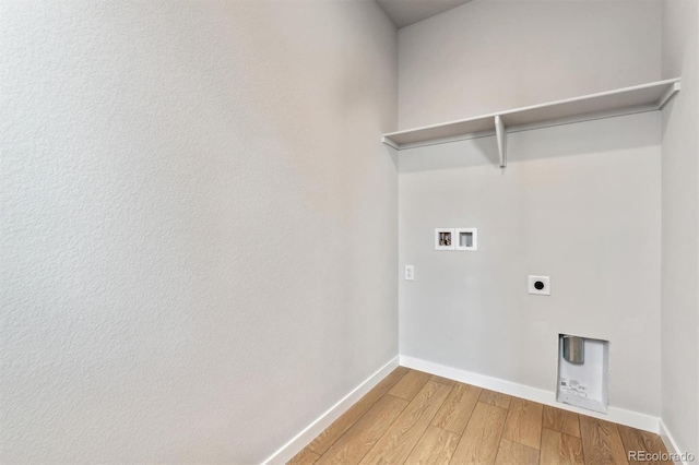 washroom featuring baseboards, laundry area, electric dryer hookup, washer hookup, and light wood-style floors