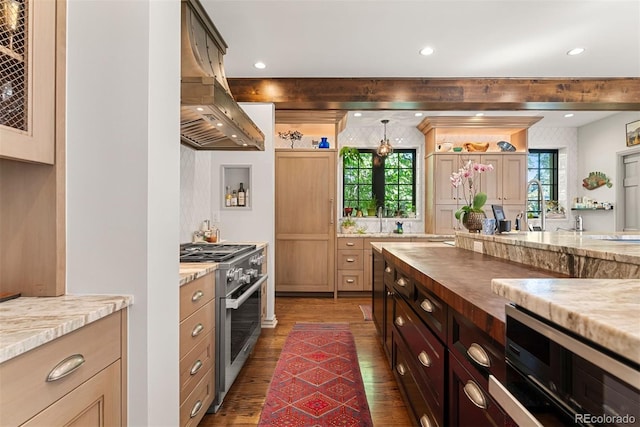 kitchen featuring light stone counters, dark wood-style flooring, island exhaust hood, open shelves, and stainless steel stove