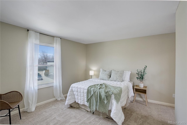bedroom with baseboards and carpet floors