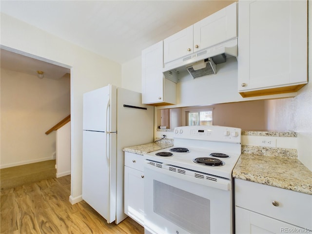 kitchen featuring white appliances, light stone countertops, light hardwood / wood-style floors, and white cabinets