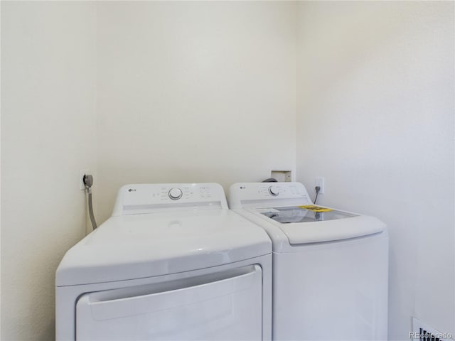 laundry area with washer and dryer