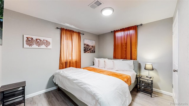 bedroom featuring wood-type flooring