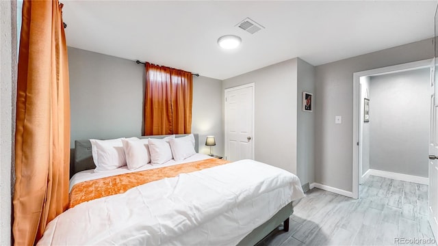 bedroom with light wood-type flooring