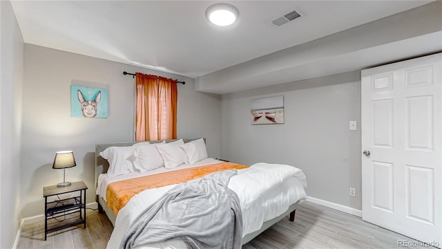 bedroom with light wood-type flooring