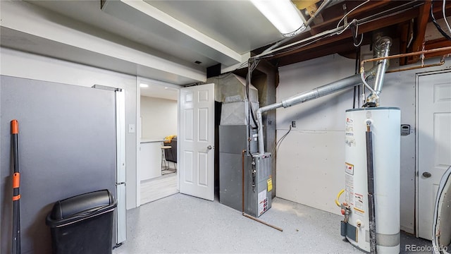 utility room featuring heating unit and water heater