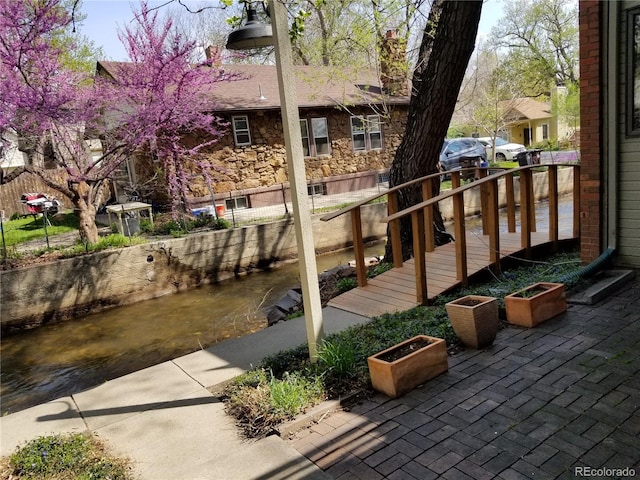 1633 18th St Unit 2, Boulder, CO 80302 - view of patio with fence and a water view