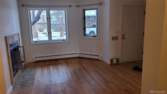 1633 18th St Unit 2, Boulder, CO 80302 - unfurnished dining area with wood finished floors, a baseboard heating unit, and baseboards