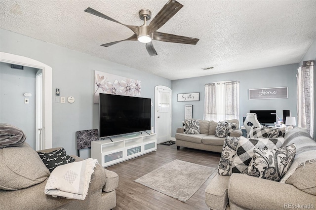 6411 E 64th Ave, Commerce City, CO 80022 - living area featuring ceiling fan, wood finished floors, and a textured ceiling