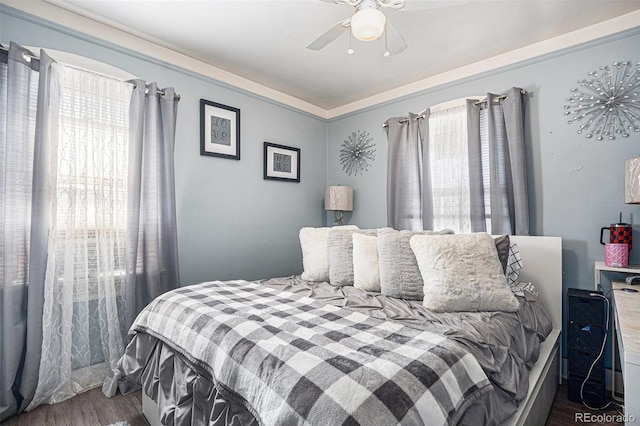 6411 E 64th Ave, Commerce City, CO 80022 - bedroom featuring wood finished floors and a ceiling fan