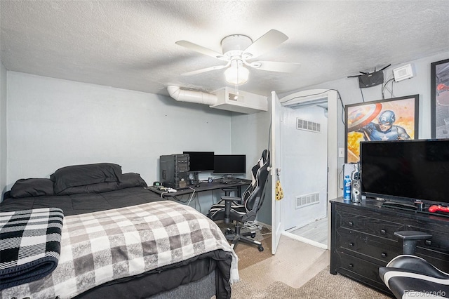 6411 E 64th Ave, Commerce City, CO 80022 - bedroom featuring a textured ceiling, carpet flooring, a desk, a ceiling fan, and baseboards