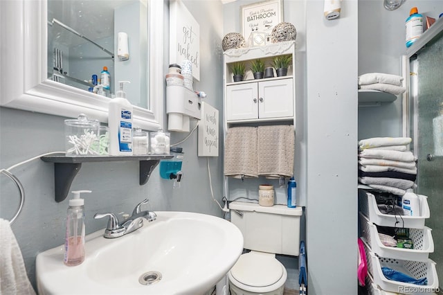 6411 E 64th Ave, Commerce City, CO 80022 - bathroom featuring a sink and toilet