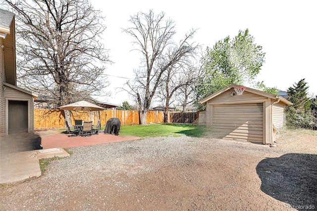 6411 E 64th Ave, Commerce City, CO 80022 - view of yard with an outbuilding, a garage, and driveway