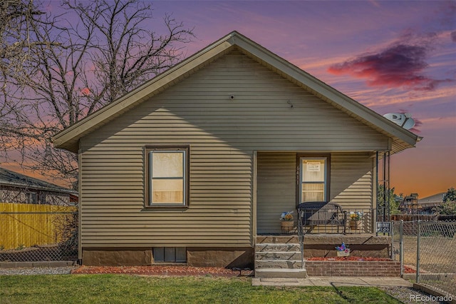 6411 E 64th Ave, Commerce City, CO 80022 - view of front of property featuring covered porch and fence