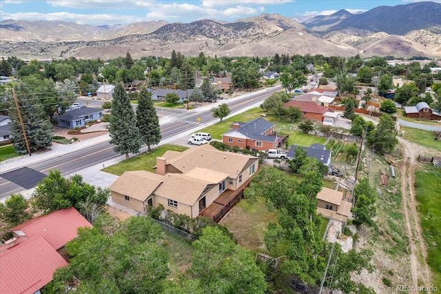 birds eye view of property with a mountain view