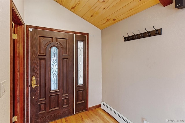 foyer with wooden ceiling, lofted ceiling, light hardwood / wood-style flooring, a baseboard radiator, and plenty of natural light