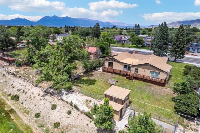 birds eye view of property featuring a mountain view