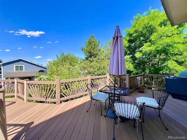 9466 Morning Glory Ln, Highlands Ranch, CO 80130 - wooden terrace featuring outdoor dining space and grilling area
