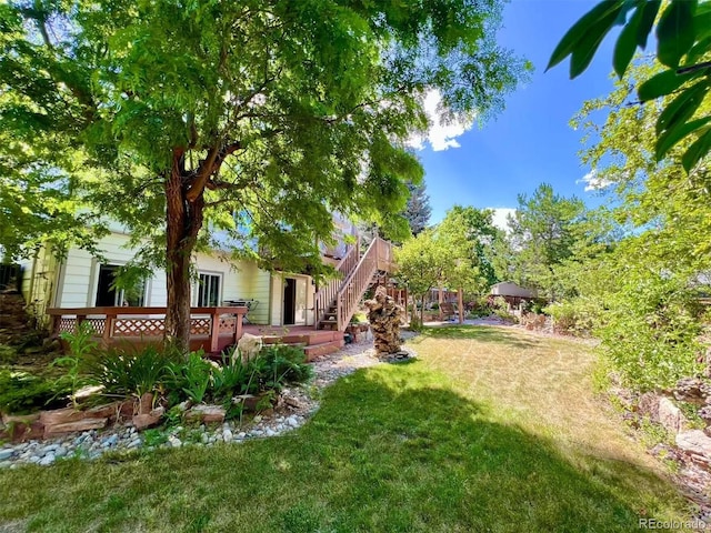 9466 Morning Glory Ln, Highlands Ranch, CO 80130 - view of grassy yard with a deck