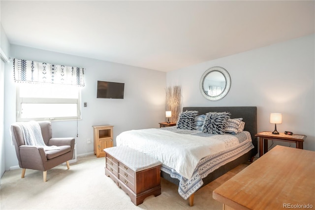 10991 E Vassar Dr, Aurora, CO 80014 - bedroom featuring light colored carpet and baseboards