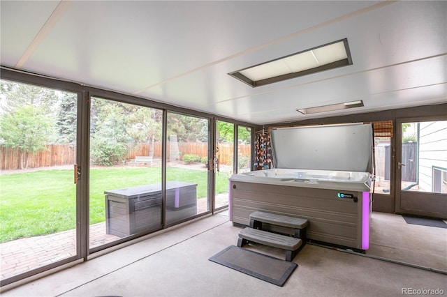 10991 E Vassar Dr, Aurora, CO 80014 - sunroom / solarium featuring a jacuzzi and plenty of natural light