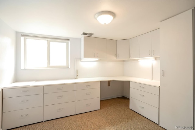 10991 E Vassar Dr, Aurora, CO 80014 - unfurnished office featuring light carpet and built in study area
