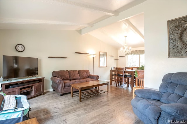 10991 E Vassar Dr, Aurora, CO 80014 - living area with a chandelier, light wood-type flooring, and baseboards