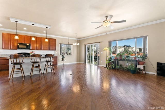 living room with baseboards, recessed lighting, ceiling fan, ornamental molding, and dark wood-type flooring