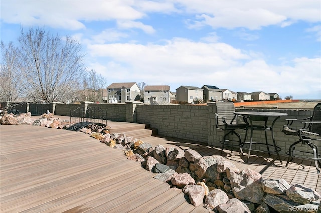 wooden terrace with fence and a residential view