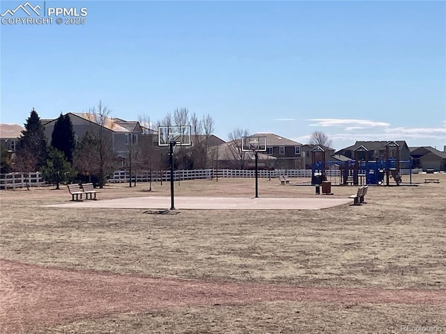 view of property's community with a residential view and fence