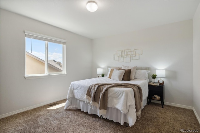 bedroom with carpet floors and baseboards
