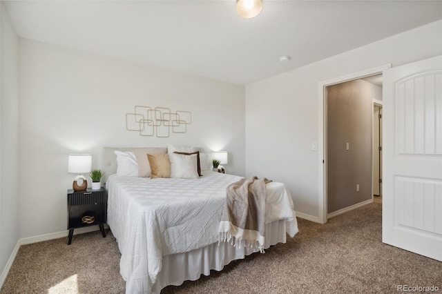 bedroom featuring carpet floors and baseboards