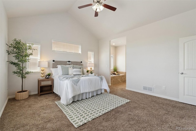 bedroom featuring carpet flooring, high vaulted ceiling, baseboards, ensuite bath, and ceiling fan