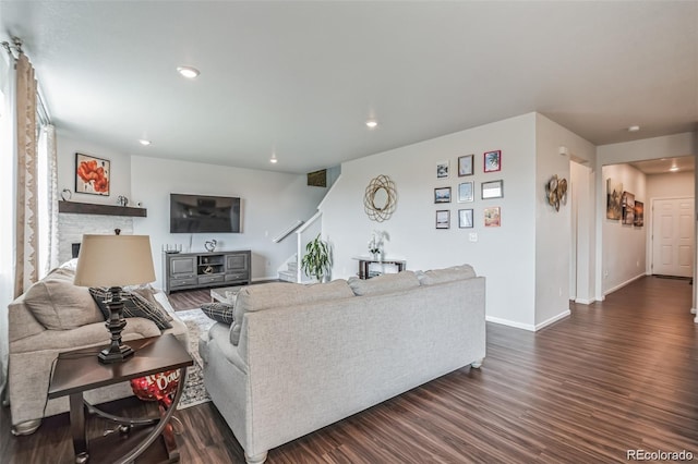 living room featuring dark wood-type flooring