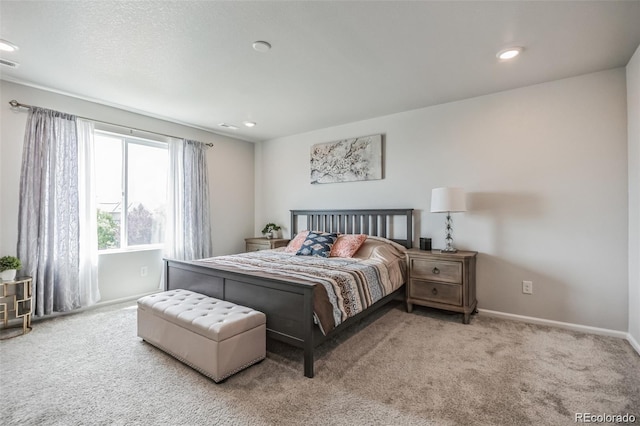 bedroom featuring light carpet