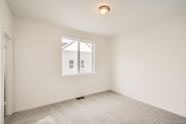 spare room featuring carpet floors