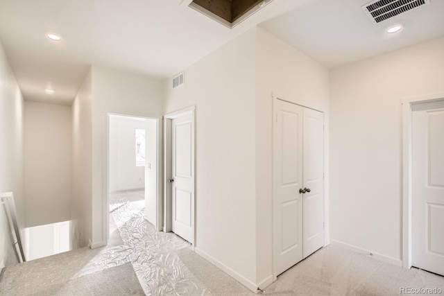 hallway with light carpet