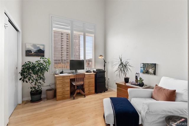 office area with light hardwood / wood-style floors