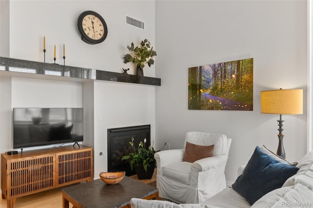 1438 Little Raven St Unit 407, Denver, CO 80202 - living area with a glass covered fireplace and wood finished floors