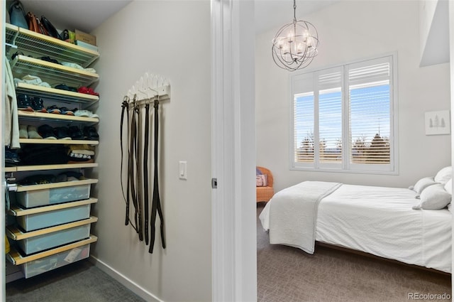 1438 Little Raven St Unit 407, Denver, CO 80202 - bedroom with carpet flooring, a chandelier, and baseboards