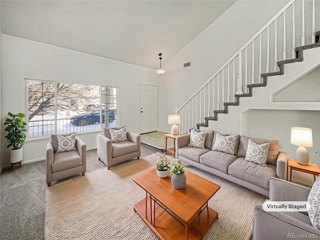 living room with light colored carpet and vaulted ceiling