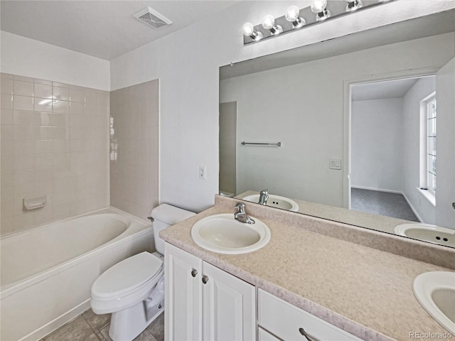 full bathroom with tile patterned flooring, vanity, shower / bath combination, and toilet