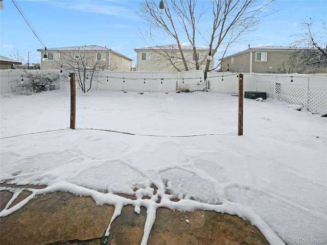 view of yard covered in snow