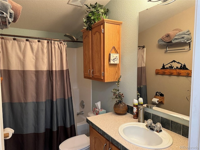 full bathroom with vanity, toilet, shower / bath combination with curtain, and a textured ceiling