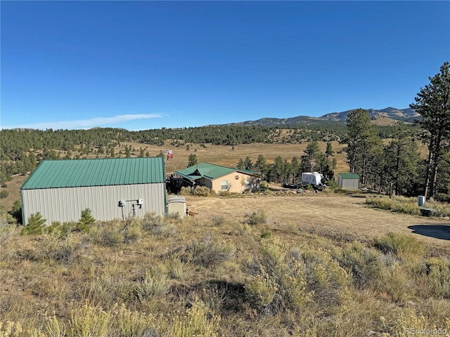 view of mountain feature with a rural view