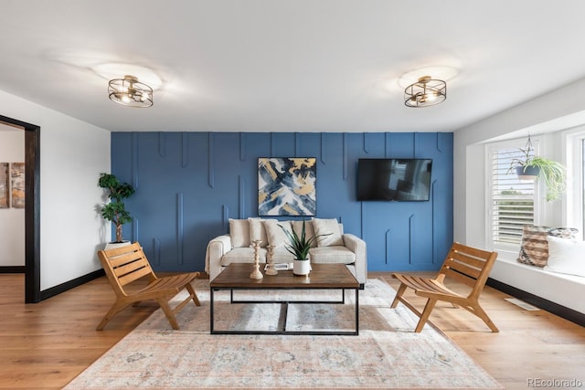 living room with light wood-style floors and baseboards