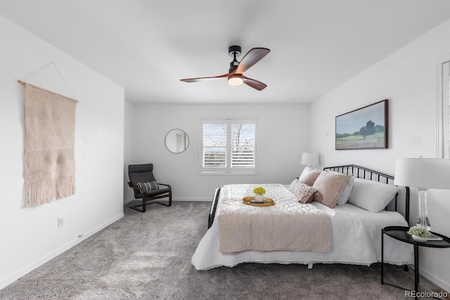 carpeted bedroom featuring baseboards and ceiling fan