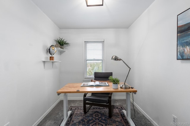 carpeted office space with baseboards