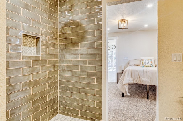 ensuite bathroom with tiled shower and ensuite bath